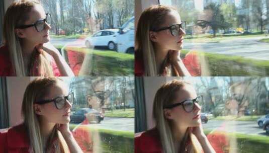 金发女子乘坐着车望着窗外高清在线视频素材下载