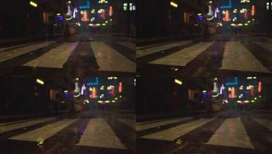 明亮的霓虹灯照亮亚洲城市街道的雨夜高清在线视频素材下载