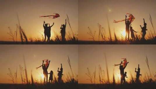4K-夕阳背景下爸爸妈妈带着女儿放风筝高清在线视频素材下载