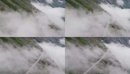 空中拍摄环绕着挪威巨魔号云层覆盖的发夹弯高清在线视频素材下载