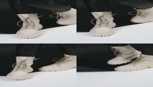 乳白色拖拉机靴与鞋带示范。高清在线视频素材下载
