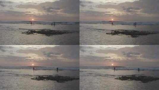 日落时人们在海滩上散步高清在线视频素材下载