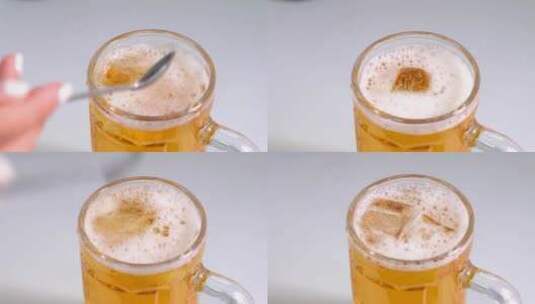 炎炎夏日冰饮往冰啤酒里加入冰块高清在线视频素材下载