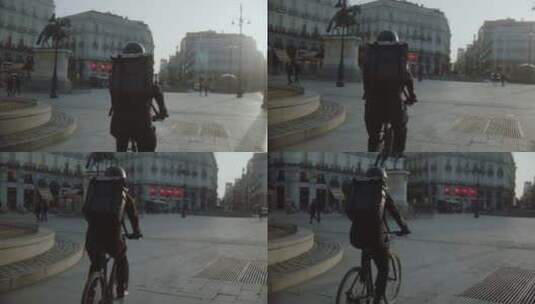 送货员自行车路过广场高清在线视频素材下载