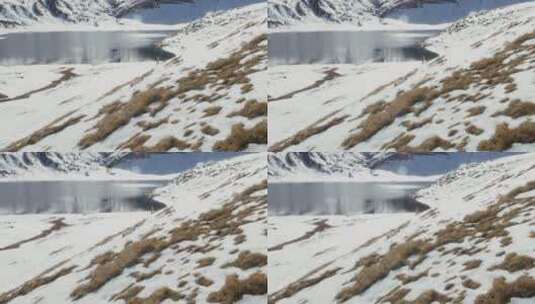 徒步旅行者走在雪湖边高清在线视频素材下载