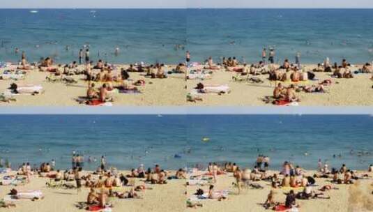 巴塞罗那海滩上的游客延时摄影高清在线视频素材下载