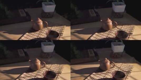 升格午后阳光照在摆着紫砂壶的木质桌子上高清在线视频素材下载