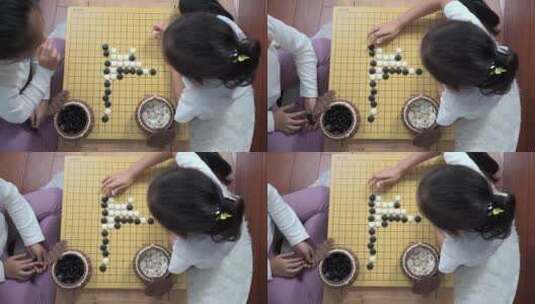 坐在地上下围棋的女孩高清在线视频素材下载