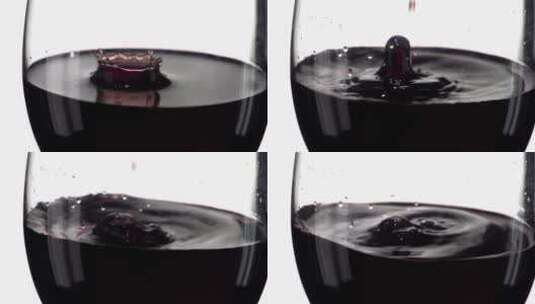 唯美浪漫红酒滴落到半满的红酒杯子高清在线视频素材下载