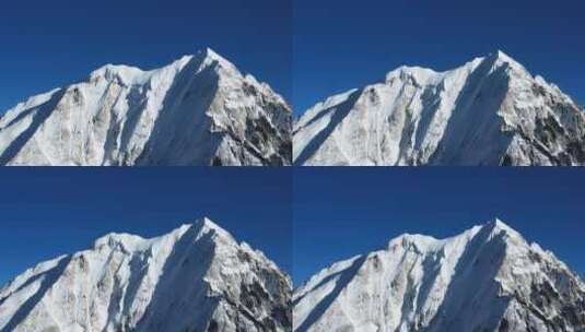 航拍川西蓝天下的雅拉雪山特写高清在线视频素材下载