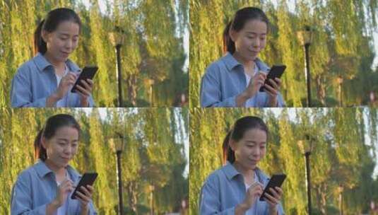 东方中国女性户外办公打电话高清在线视频素材下载