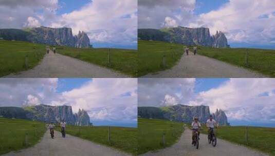 山区小路骑自行车的一对男女高清在线视频素材下载