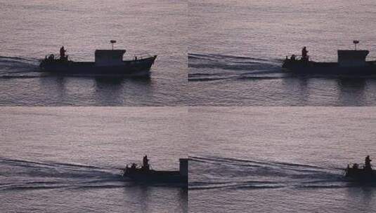 烟台大黑山岛，海上日出渔民出海打渔高清在线视频素材下载