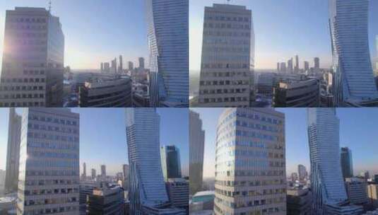 阳光下摩天大楼的市区航拍高清在线视频素材下载