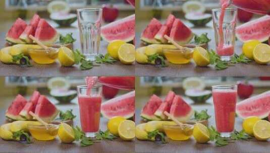 西瓜榨汁倒入杯中的特写镜头高清在线视频素材下载