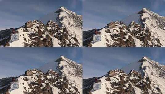 航拍四川岷山山脉雪宝顶雪山山脊上的登山队高清在线视频素材下载