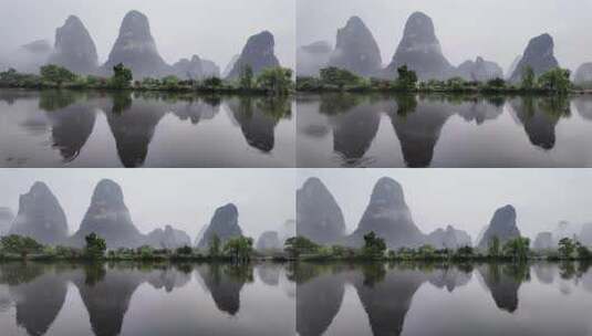 雨天湖景倒映绿树青山的宁静画面高清在线视频素材下载