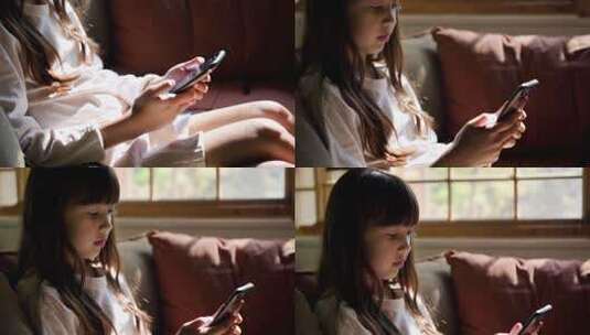 女孩坐沙发上玩手机素材高清在线视频素材下载