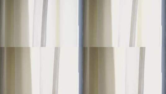 风吹窗帘窗户白色窗帘飘动阳光透过白色窗帘高清在线视频素材下载