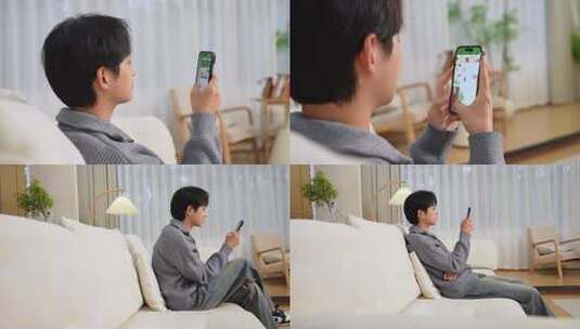 男子居家玩手机高清在线视频素材下载