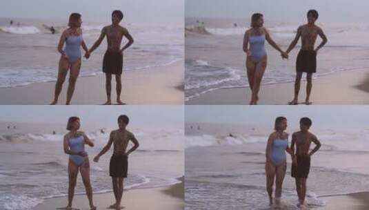 在海滩上跑步的情侣高清在线视频素材下载