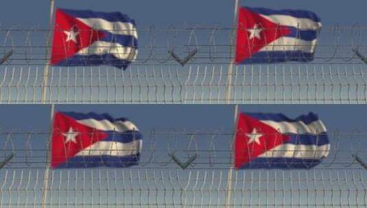 铁丝网后模糊的古巴国旗高清在线视频素材下载