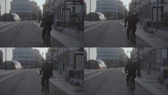 送货员在城市街道骑自行车高清在线视频素材下载