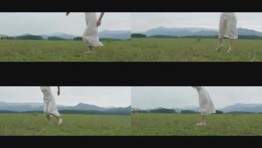 白色连衣裙女子在草原上跳舞舞步特写高清在线视频素材下载