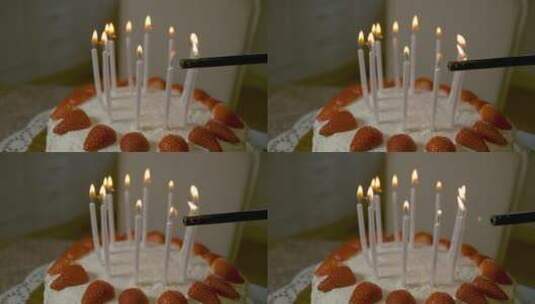 无法辨认的人用打火机点燃生日蛋糕蜡烛。高清在线视频素材下载