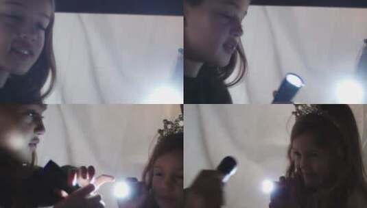 孩子们在帐篷玩手电筒高清在线视频素材下载