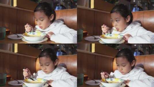4K升格实拍堂食在西餐厅喝奶油汤的亚洲女孩高清在线视频素材下载