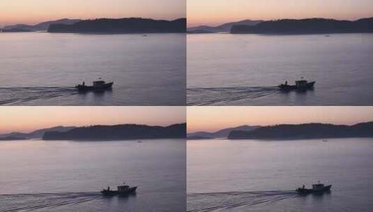 烟台大黑山岛，海上日出渔民出海打渔高清在线视频素材下载