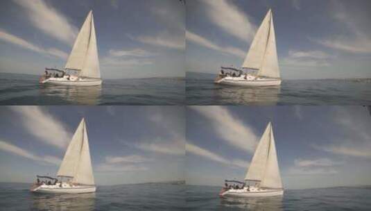蓝色大海中航行的白色帆船高清在线视频素材下载