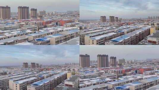 城镇居民楼屋顶雪景变焦高清在线视频素材下载