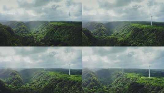 航拍绿色丛林风车风景高清在线视频素材下载
