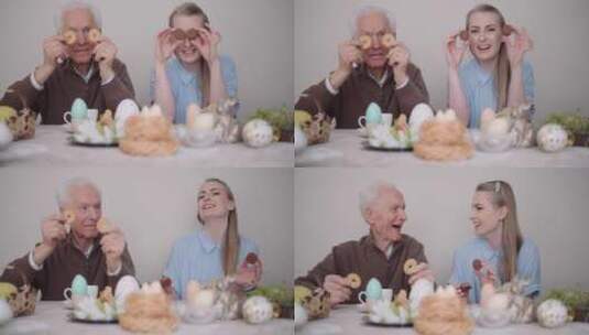 祖父和孙女拿饼干说笑高清在线视频素材下载