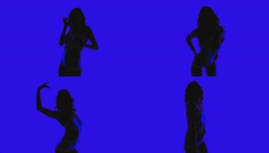 女人在蓝色背景前性感热舞高清在线视频素材下载