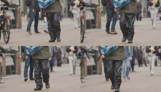 街道上人们双腿行走的长镜头拍摄高清在线视频素材下载