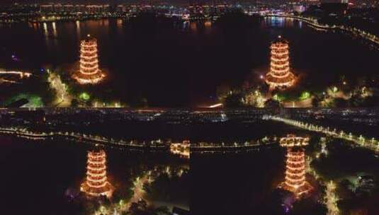 东莞航拍华阳湖湿地公园华阳塔夜景左环绕高清在线视频素材下载