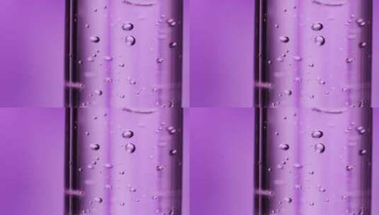 滴管伸进瓶中吸取精华紫色美妆高清在线视频素材下载