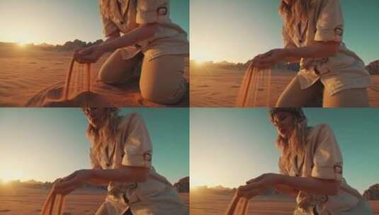 在沙漠里玩沙子的女人高清在线视频素材下载