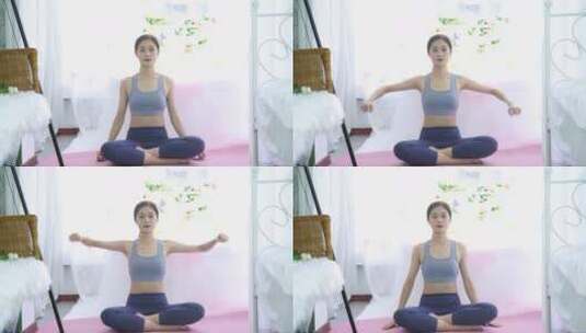 室内做瑜伽运动的年轻女性高清在线视频素材下载
