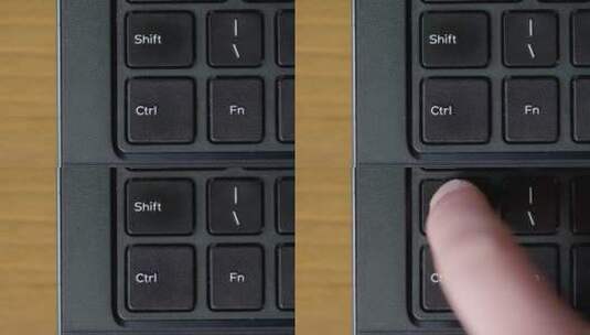 手指推动移位键盘按钮俯视图高清在线视频素材下载
