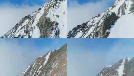 无人机贴着山脊飞行雪山蓝天航拍风景高清在线视频素材下载