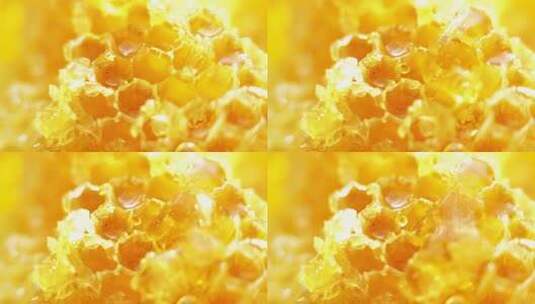 蜂蜜滴落在金色的蜂窝上高清在线视频素材下载