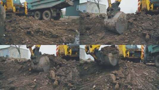 在农村的道路工程中，挖掘机臂舀起一桶土和石头高清在线视频素材下载