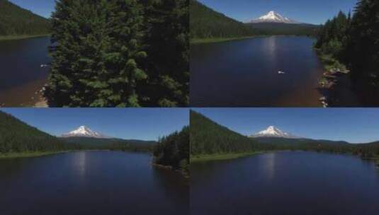 人们在森林和白雪皑皑的高山天线旁的湖里游高清在线视频素材下载