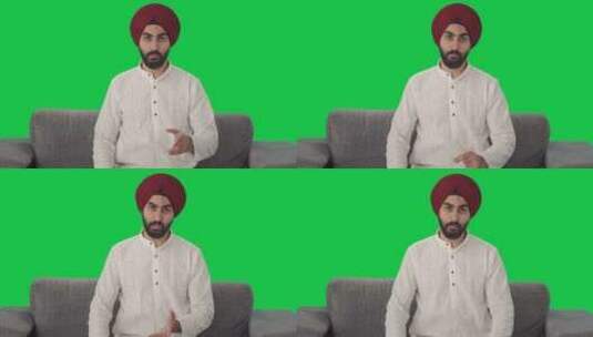 锡克教印度人和某人说话绿屏高清在线视频素材下载