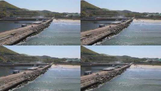 航拍威海金海滩海水浴场智明水产养殖码头高清在线视频素材下载