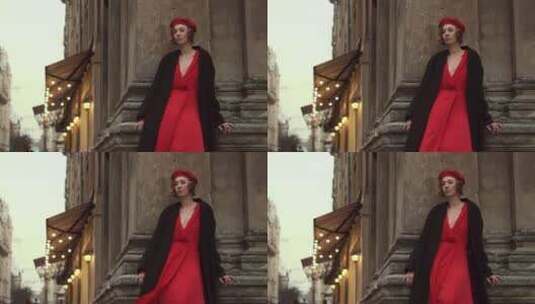 红色连衣裙模特站在复古建筑旁高清在线视频素材下载